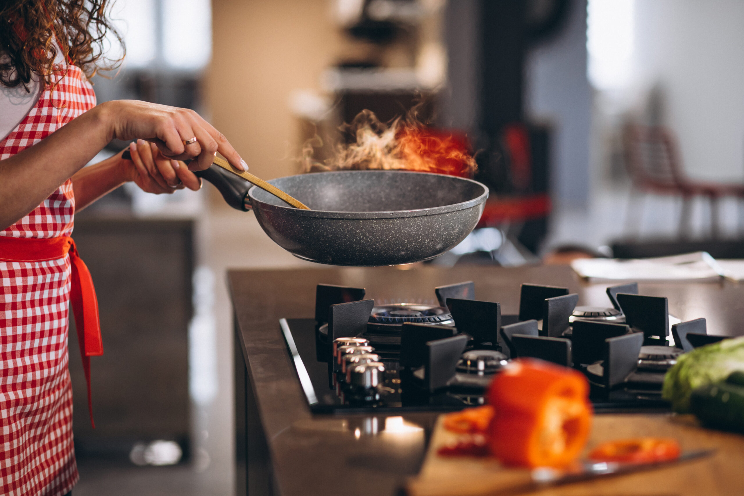 Woman chef cooking vegetables in pan SideDishBox-About-Us